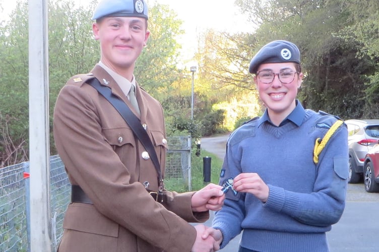L-R- Second Lieutenant Joe Manners with Flight Sergeant Liv Walker receiving the Gold Crossed Rifle badge. It was also her last parade with 2443 Squadron.