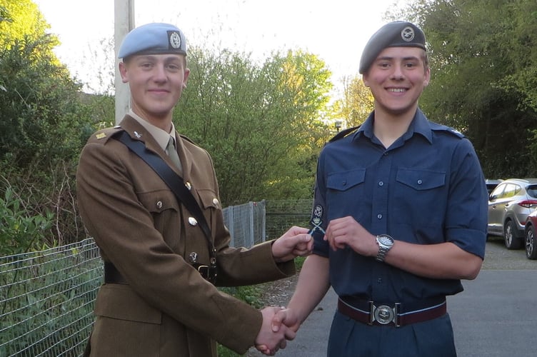 L-R- Second Lieutenant Joe Manners with Corporal Ollie Walker receiving the Gold Crossed Rifle badge.