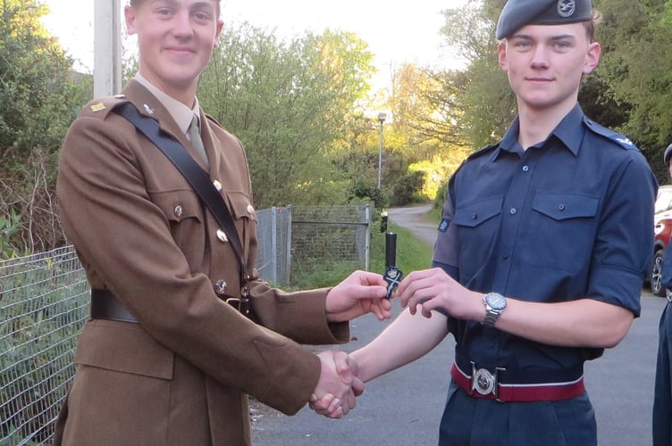 L-R- Second Lieutenant Joe Manners with Corporal James Huyton receiving the Gold Crossed Rifle badge