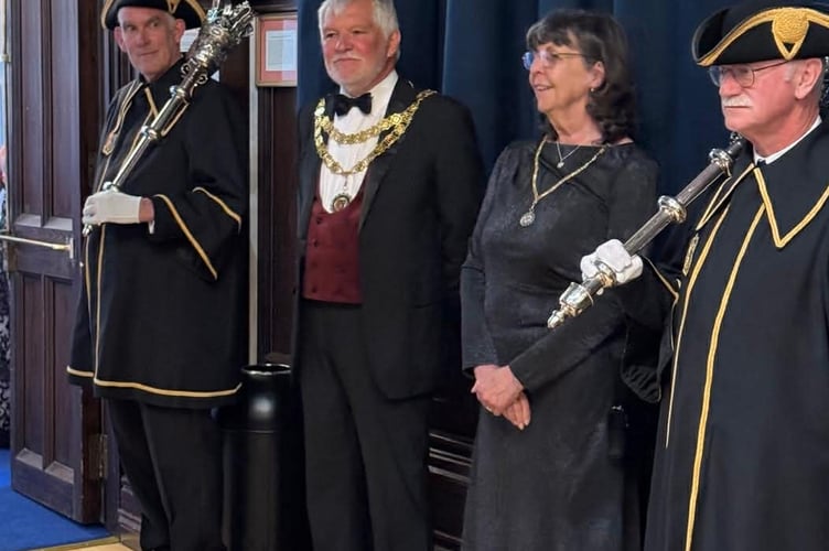 Tavistock Town Mayor Cllr Steve Hipsey, second from left, welcomes guests at the Tavistock Civic Ball in the town hall.