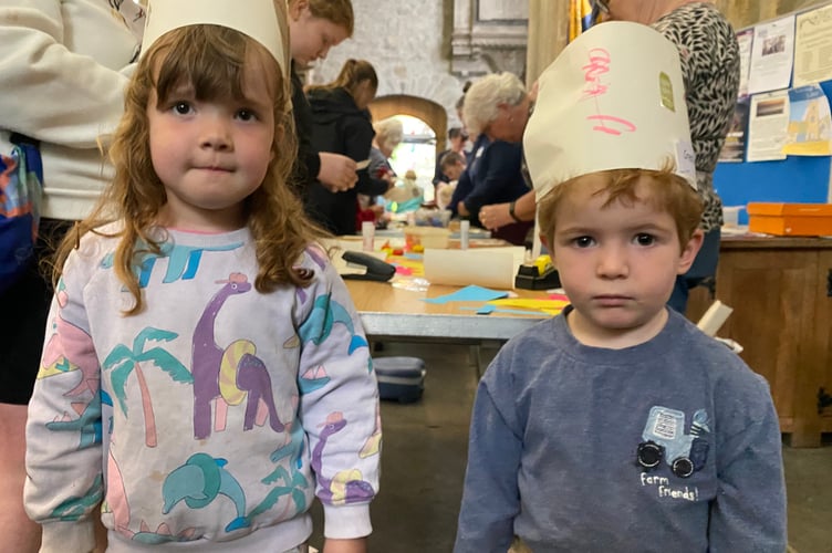 Cousins. Heather Carstens (three), and Isaac Dutton (two),  enjoying Tavistock Parish Church Messy Church ten-year birthday.
