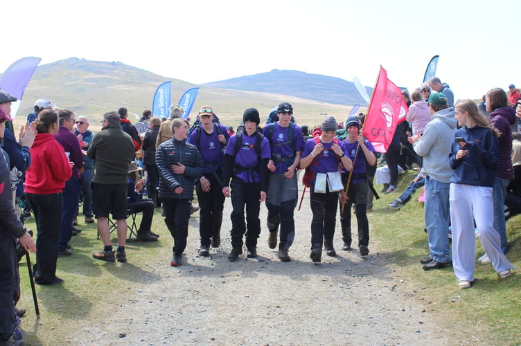 A triumphant Tavistock College 2026 Ten Tors team celebrate conquering the hills.