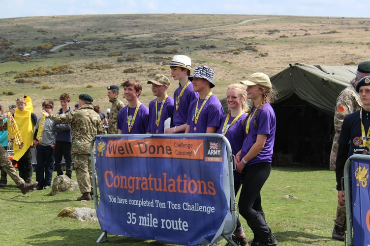 A triumphant Tavistock College 2026 Ten Tors team celebrate conquering the hills.
