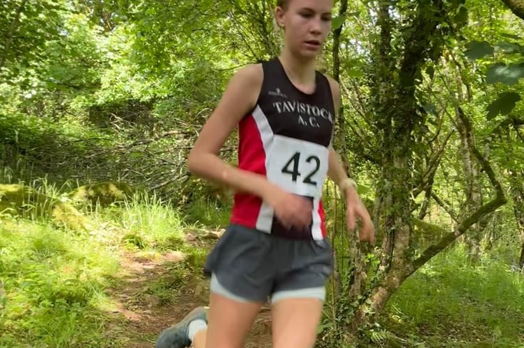 A young Tavistock Athletic Club runner enjoying some shelter from the heat during the Langstone Fell Race.