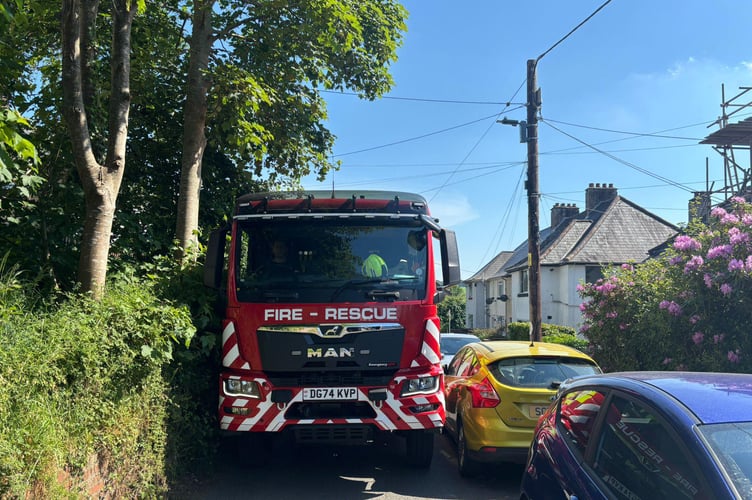 Yelverton firefighters are appealing to parking drivers to leave room for fire appliances in villages after being held up on an emergency call.