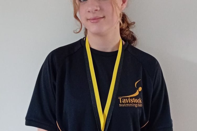 Cora George, of Tavistock Swimming Club, with her 200m butterfly medal from the club's 2026 long distance championship.