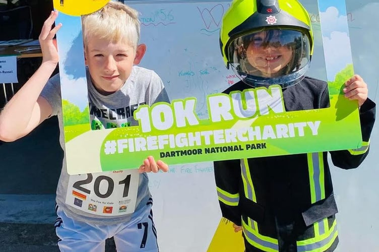 Harry Wildgoose, 11, (left) before his Princetown Fire Station 10km race.