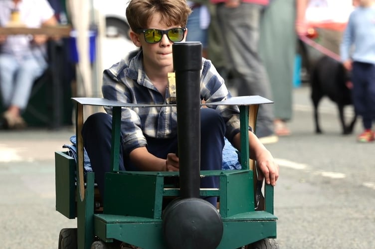 Starting small: A lad keeping up with the big engines at Tavistock Robey Trust Tavistock Steam Fair. Picture by Chris Cottrell.