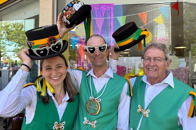 Simon Read, the Squire of Exeter Morris, centre, and two fellow dancers.  AQ 2248
