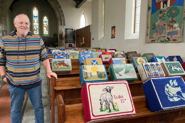 Bere Alston Church kneelers shown off by Andy Bottomley, Holy Trinity Church worker.