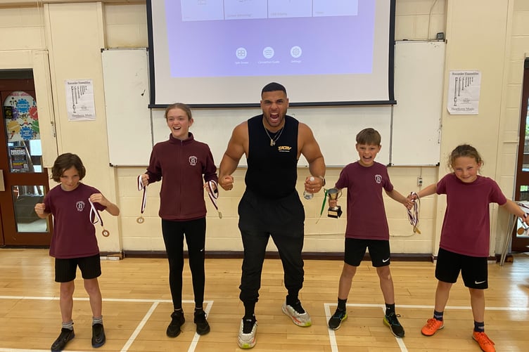 TV Gladiator Steel motivates sporting Horrabridge youngsters.