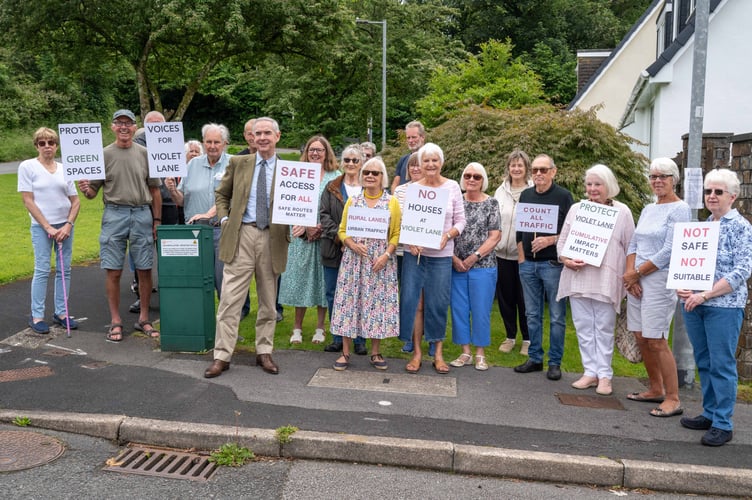 Protestors against a planned housing estate on two fields on Violet Lane, Tavistock, were joined by supporter Sir Geoffrey Cox, Torridge and Tavistock MP.