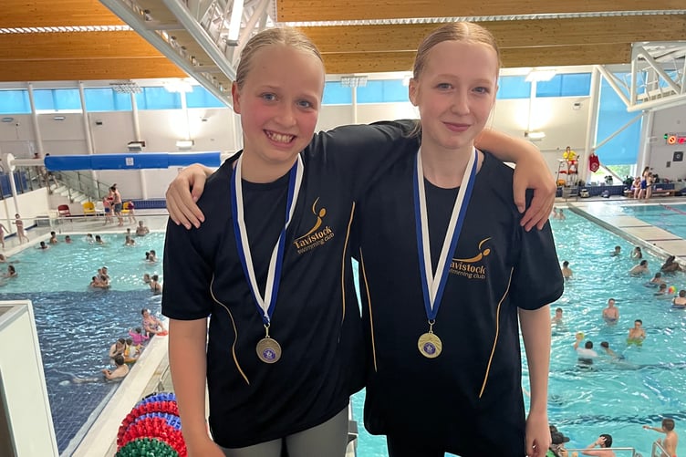 Tavistock Swimming Club's proud Lottie Squire and Lily Shutt with their medals gold at Devon ASA sprint meet.