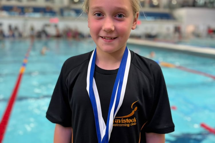 Tavistock Swimming Club's Megan with her gold at Devon ASA sprint meet.