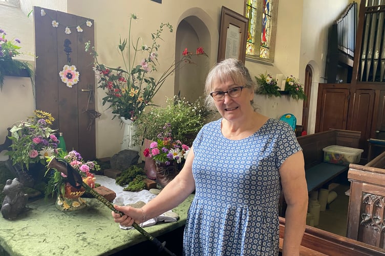 Sheena Tarbotton with her Milton Abbot Church Flower Show display 'Going for a Walk'.