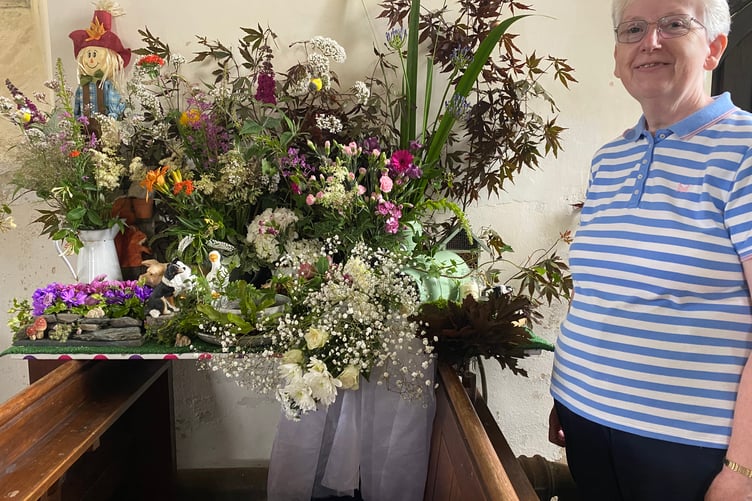 A blooming lovely Milton Abbot Church Flower Show display raising funds for the church heating.