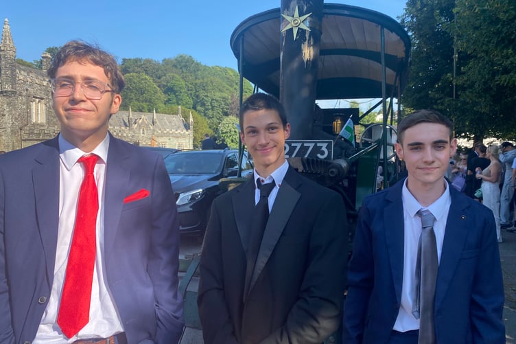 Steaming ahead are students Leon Spry, Dylan Lacey and Raith Glover arriving by Robey Trust steam engine. The three joined hundreds of families and classmates in Tavistock's Bedford Square for Tavistock College pre-proms gathering.