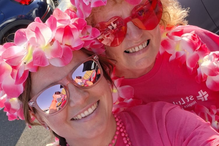 Pretty in pink: Friends from West Devon; Denise Bettey, and Dotty King walked the St Luke's Hospice charity Midnight Walk on a hot evening.