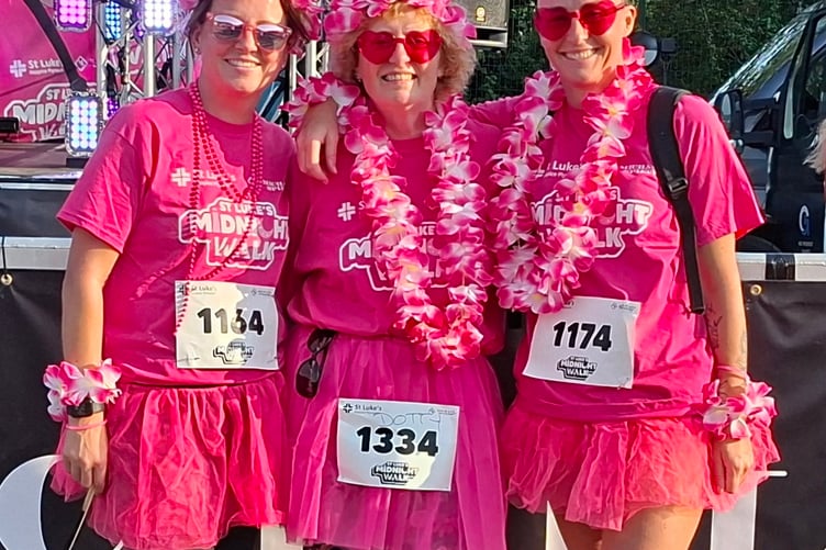 Pretty in pink: Three friends from West Devon; Denise Bettey, Dotty King and Emma Williams walked the St Luke's Hospice charity Midnight Walk on a hot evening.