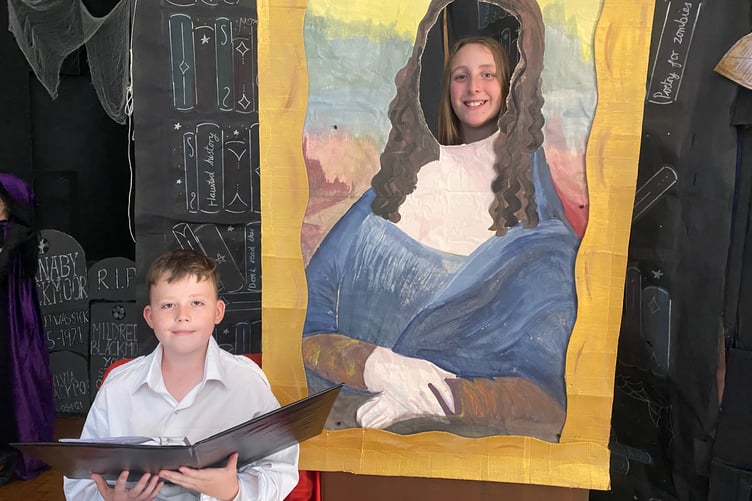 Tavistock Primary School's summer production of When Thursday Became Wednesday horrified then spread happiness into audiences. Pictured are the narrator Oliver and 'live' painting Daisy.