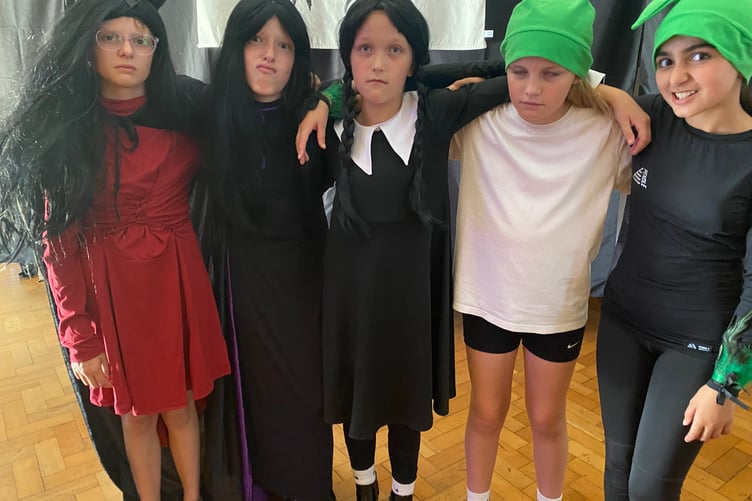 Thursday, centre, played by Flora. Tavistock Primary School's summer production of When Thursday Became Wednesday horrified then spread happiness into audiences. Pictured is Thursday, centre, played by Flora.