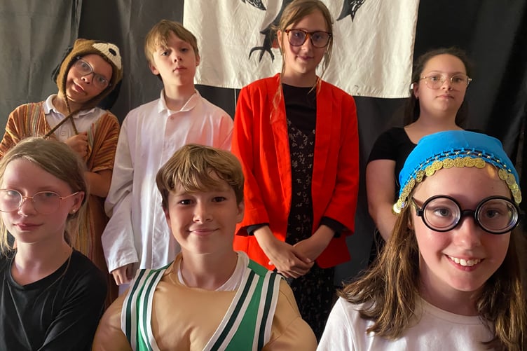 Tavistock Primary School's summer production of When Thursday Became Wednesday horrified then spread happiness into audiences. Pictured are some of the talented singer/performers.