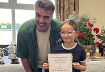 Local boy made good presents prizes at village flower show