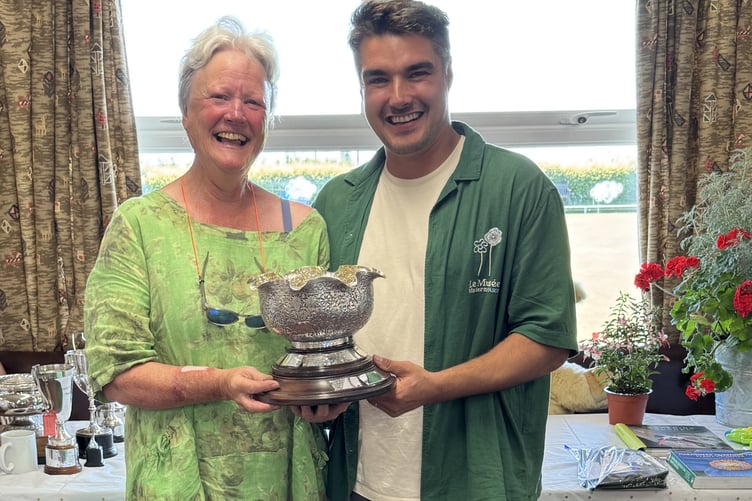 Harriet Ellis scoops best exhibit trophy at Bere Alston Flower and Produce Show.
