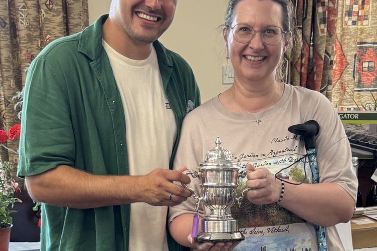 Suzanne Lawrence rewarded for her green fingered skills at Bere Alston Flower and Produce Show.