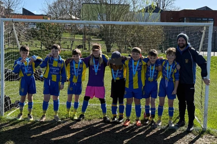 Bere Alston School celebrates it's record standard assessment test results with success also on the playing field. The football team is pictured with Headteacher Gareth Bemister.