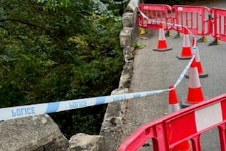 Lydford villagers and residents are being forced to make lengthy diversions after the bridge was closed due to a vehicle crash demolishing the roadside wall.