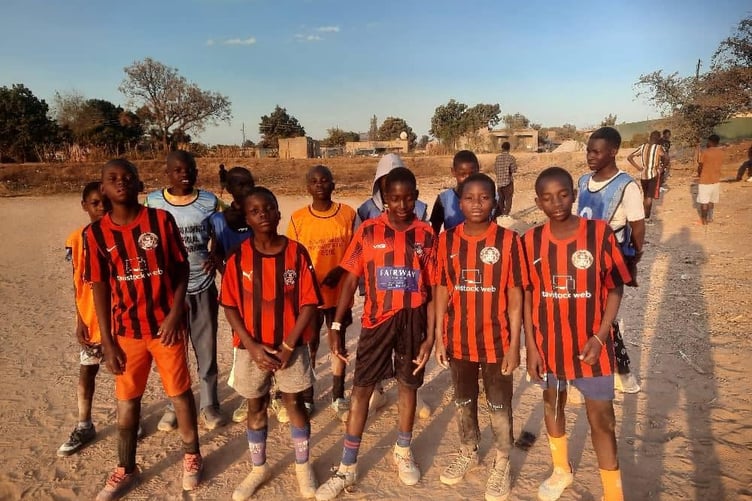 Tavistock FC's reach has extended to inspiring football-mad boys in Africa through an international kit sharing project.