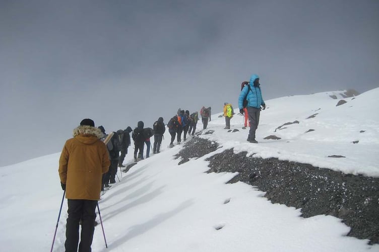 Darren Warkcup and his team hit the snow line on their sponsored Mt Kilimanjaro climb in aid of the Down's Syndrome Association charity.