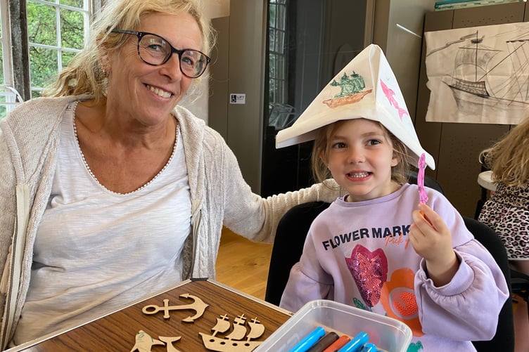 Darcy, 4, and her nanny Nicky, both enjoying a pirate-themed summer holiday activity session at Tavistock Guildhall.