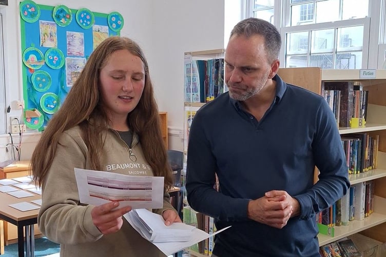 Tichy Sanders with her results with Shebbear head Charlie Jenkins