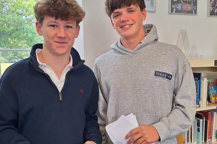 Archie Richards and Jack Down collecting their GCSE results at Shebbear College.