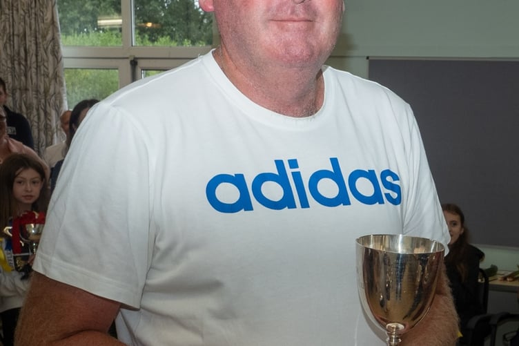 Top gardener Ian Jenkins with another trophy at Walkhampton Flower and Produce Show. Picture by Jean Jameson.