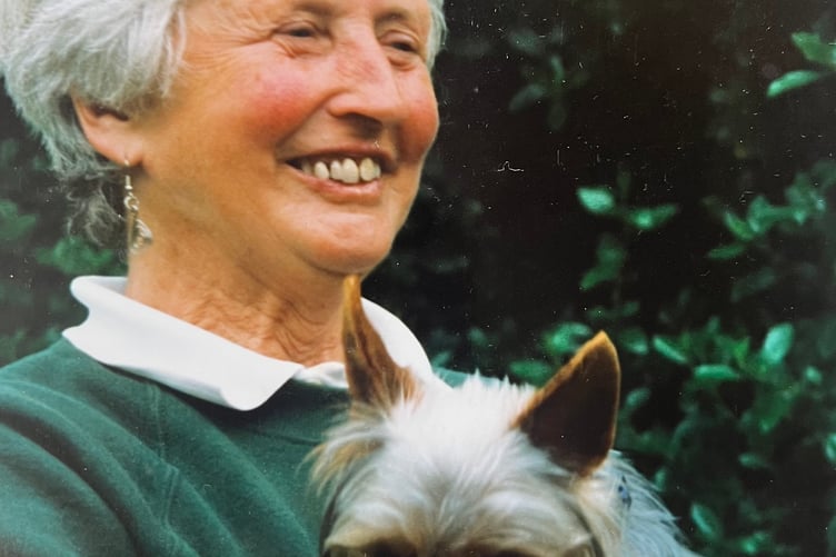 The late Doris Chapman has been remembered with fondness and gratitude by Bere Peninsula residents for her service to the community. She is pictured with one of her beloved pet dogs.