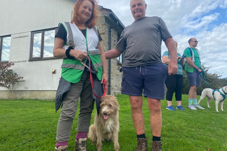 Rosie and Barry Crook with rescue pet dog Coco in the Margaret Green sponsored mass dog walk.
