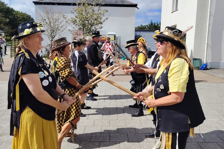 Crowds were entertained to drum rhythms, accordions, stick and drum banging and chanting as morris groups entertained Princetown crowds at the mass celebrations of Border Morris group's 25 years.