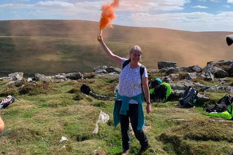 Gilby's widow, Jane, released a flare to mark the end of the climb to the top of Belstone Tor. Credit: Jane Taylor.