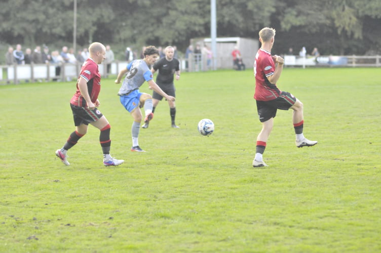Lewis Perring watches as Kian Burch lets off a shot