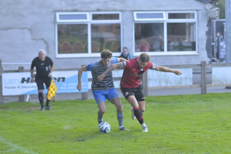 Former Buckland teammates Ryan Smith and Owen Stockton tussling