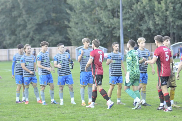 Pre-match handshakes between Bovey Tracey AFC and Tavistock AFC