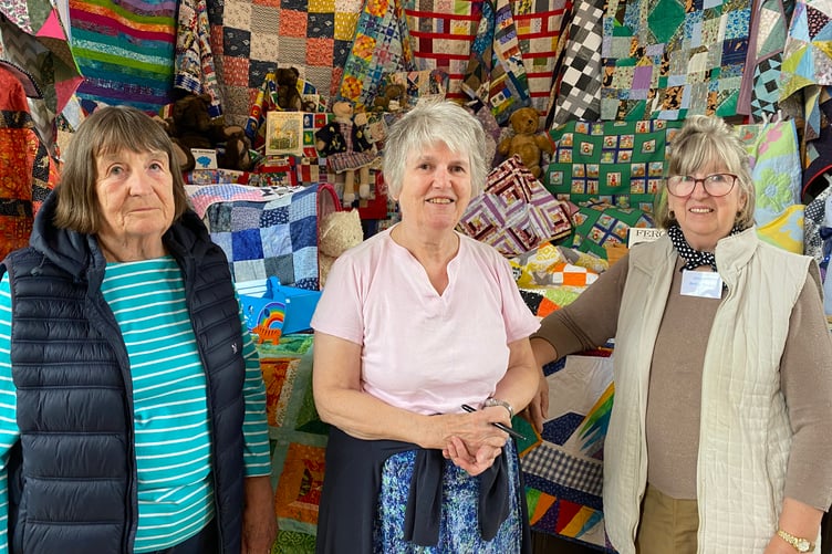 Goosey Quilters group members at their Tavistock Town Hall exhibition including quilts for Project Linus which donates them to sick and disadvantaged babies and youngsters.