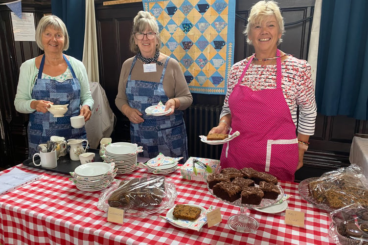 Refreshments are served by the Goosey Quilters group at the community needleworkers' exhibition in. Tavistock Town Hall.
