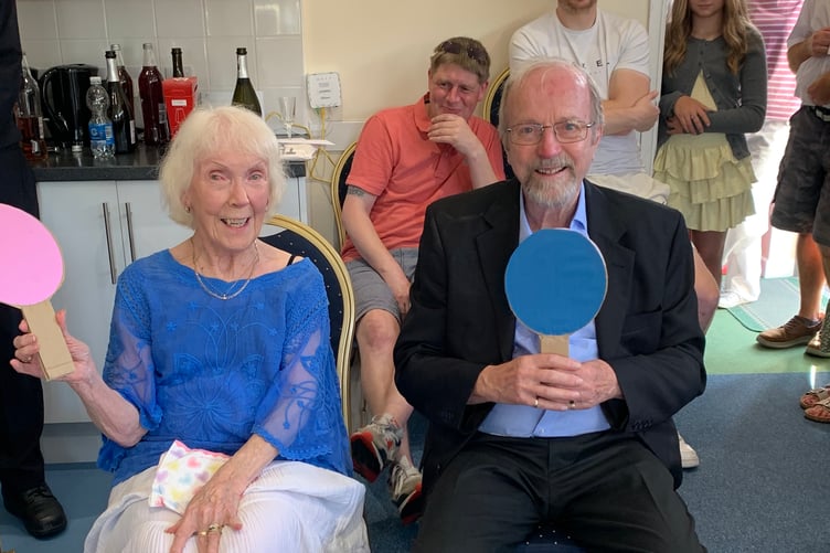 Staff and volunteers at Abbeyfield residential home in Tavistock celebrated the marriage of long-term volunteers Roy and Rotha Cole. Pictured are the happy couple playing a traditional Mr and Mrs game at the post-wedding party.