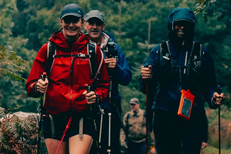 Adventurous trekkers hike across moorland tors in wet weather in aid of Dartmoor Search & Rescue Team Tavistock. Picture by Matt Caine.