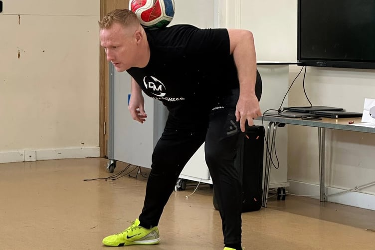 Dan Magness wows Lifton Academy pupils with his freestyle football skills.