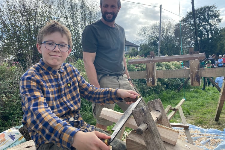 Learning hand craft wood skills by Salterton Wood with Andy Morton in the background at Bere Apple Fest.